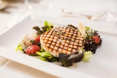 a plate of food on a white plate at Hotel Funggashof in Naturno