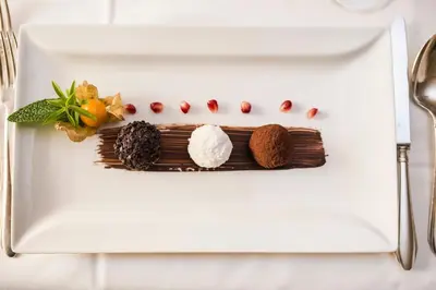a plate with some food on top at Hotel Funggashof in Naturno