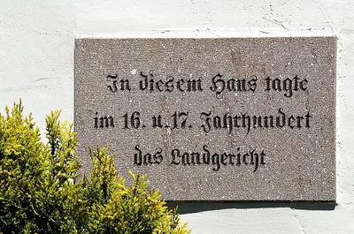 a sign on the side of a building at Hotel Zum Turm in Castelrotto