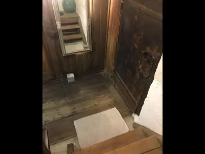 an overhead view of a bathroom with wooden floors and a mirror at Knottn Hüttl, St. Pankraz/Ulten, Nähe Meran in San Pancrazio dʼUltimo