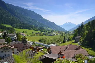 a town in a valley with mountains in the background at Residence Talblick in San Leonardo in Passiria