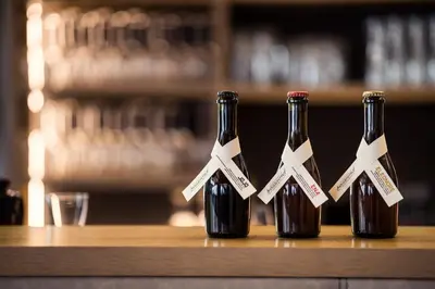 three bottles of wine sitting on a counter at Felderer Boutiquehotel B&B in Caldaro