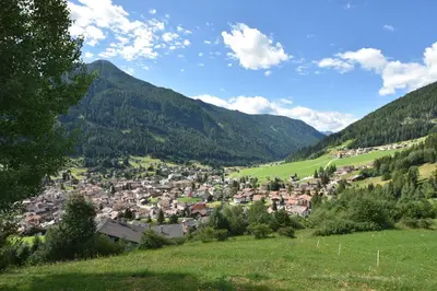 a small town in a valley in the mountains at Kyrr Smart Mountain Retreat in Moena