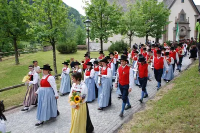 a large group of people walking down a street at Kyrr Smart Mountain Retreat in Moena