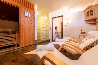 a room with a group of chairs in a room at Hotel Garni Nachtigall in Schenna
