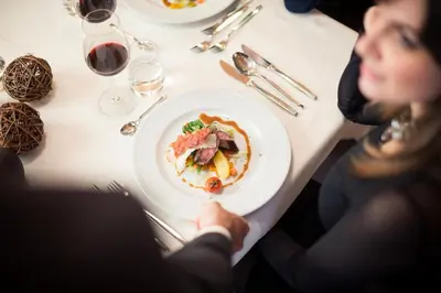 a glass plate with food on a table at Hotel Mühlgarten in San Lorenzo di Sebato