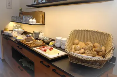 a kitchen counter with a basket of food on it at Garni Grünau in San Martino