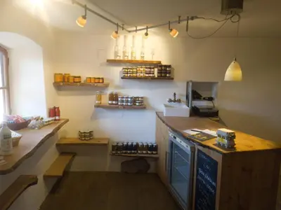 a kitchen with a counter with bottles on the wall at Finhäusl in Aldino