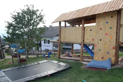a playground with a slide and a play structure at Finhäusl in Aldino