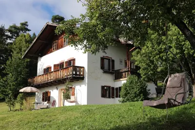 a white house with balconies on the side of it at Finhäusl in Aldino