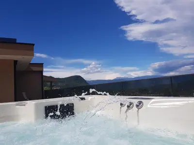 a hot tub with water spraying out of it at Aparthotel Malga in Caldaro