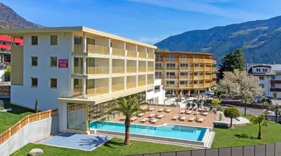 an aerial view of a hotel with a swimming pool at Hotel Nocturnes in Naturno