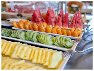 a buffet with several plates of different types of food at B & B Gurterhof in Schenna