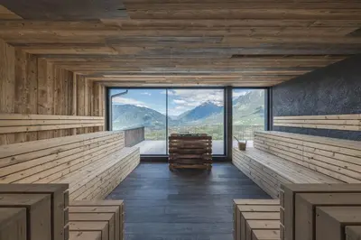 a bathroom with a large white tub in a room at Hotel Alpenrose in Schenna