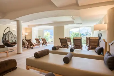 a living room with chairs and a couch at Hotel Wessobrunn in Merano