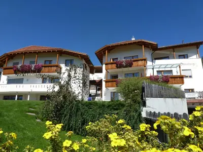a building with flower boxes on the balconies at Residence Sonnberg in Perca