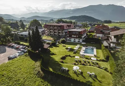 an aerial view of a hotel with a resort at Hotel Reischach in Brunico