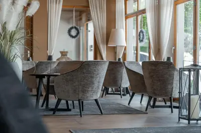 a dining room with a table and chairs at Hotel Reischach in Brunico