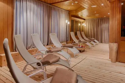 a row of chairs in a waiting room at Hotel Reischach in Brunico