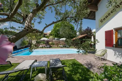 a view of the pool from the backyard of a house at Ferienwohnungen Lanserhof in Appiano sulla Strada del Vino