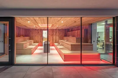 a row of beds in a room at Panoramahotel Huberhof in Maranza