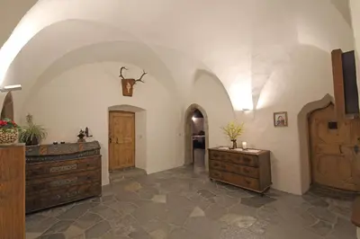a room with two dressers and a hallway with a door at Ansitz Zehentner in Laion