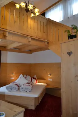 a room with a bunk bed in a cabin at Häuslerhof in Maranza