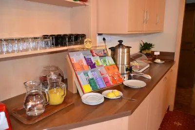 a kitchen counter with some food and drinks on it at Häuslerhof in Maranza