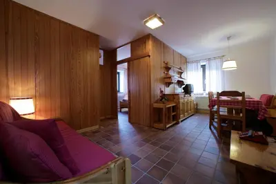 a living room with a couch and a table at Hotel Garni Gonzaga in Canazei