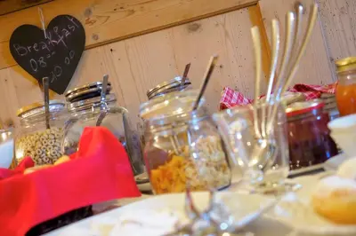 a bunch of jars of food on a table at Maso Vaia in Cavalese