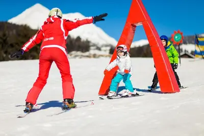 a group of people on skis in the snow at Family Home Alpenhof in Maranza
