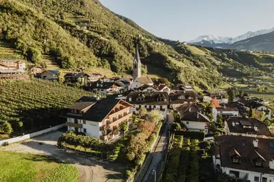an aerial view of a small village in the mountains at Thalguter - Rooms & Breakfast in Lagundo