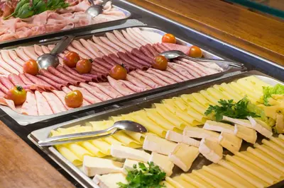 a buffet with many different types of meats and cheese at Hotel Klotz in San Leonardo in Passiria