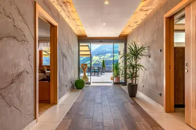 a hallway of a house with a plant at Hotel Kronhof in Moso