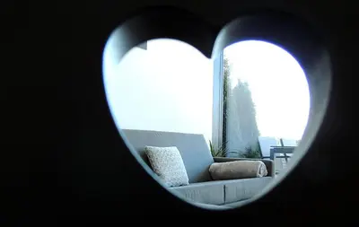 a living room with a couch and a window at Residence Moritz in Avelengo