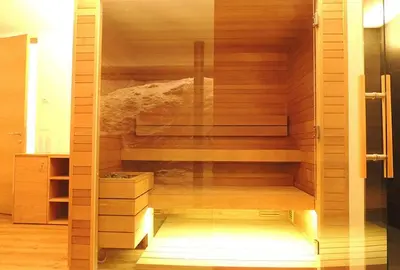 a sauna with wooden walls and wooden floors at Residence Moritz in Avelengo