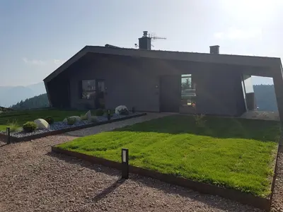 a house with a green lawn in front of it at Residence Moritz in Avelengo