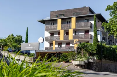 a building with balconies on the side of it at Hotel Traminerhof in Termeno