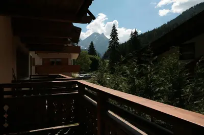 a balcony with a view of a mountain at Villetta ai Pini Deluxe in Canazei