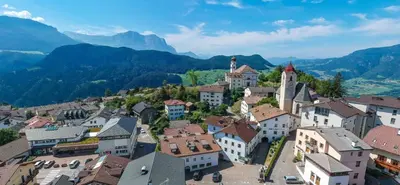 an aerial view of a town in the mountains at Albergo Gasthof zur Krone in Laion