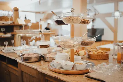 a kitchen with a counter with food on it at Hotel La Soldanella in Moena