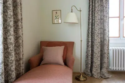 a chair with a pillow on it in a room at Gasthof Kohlern 1130 m in Bolzano