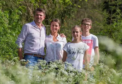 a group of people standing in a field at Hotel Foestlerhof in Villa Ottone