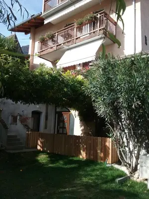 a house with a balcony and a yard at Haus Möltner - Apartment 