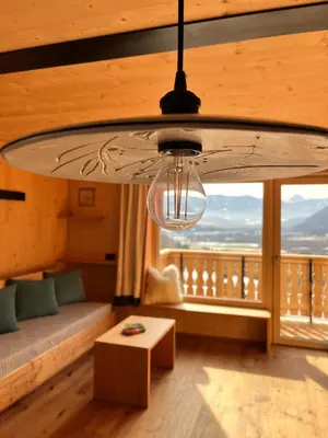 a large chandelier in a room with a couch and a table at Bio Felderhof in Villa Ottone