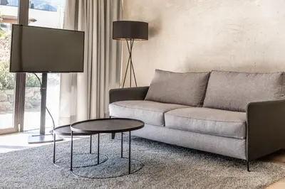 a living room with a couch and a table at Marchegg Apartments in Naturno