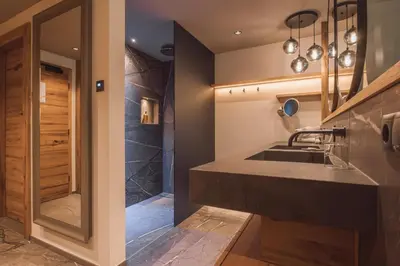 a bathroom with a sink and a shower at Hotel Fürstenhof in Schenna