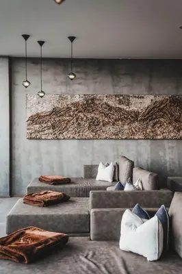 a living room with three couches and a painting at Hotel Fürstenhof in Schenna