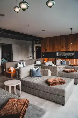 a living room with two couches and a couch at Hotel Fürstenhof in Schenna