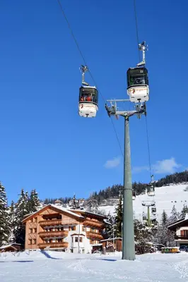 a ski lift in a ski resort in the snow at Villa Sole in San Vigilio Di Marebbe